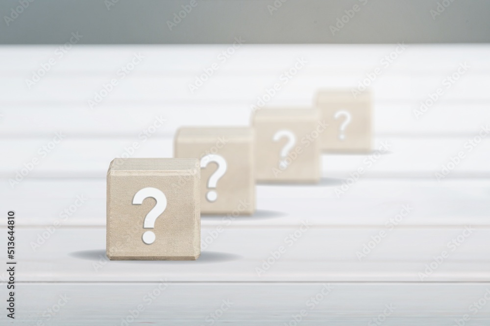 wooden blocks with a question mark. frequently asked questions marketing plan for educational ideas