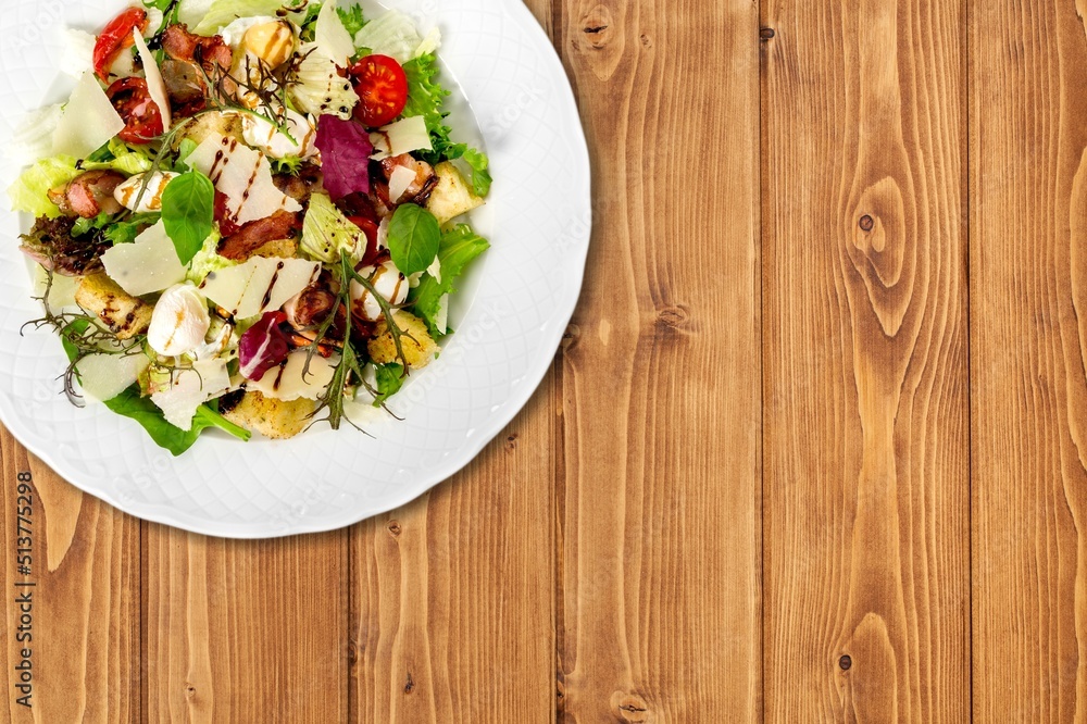 Fresh spring vegetable salad with tomatoes and peppers in the bowl.