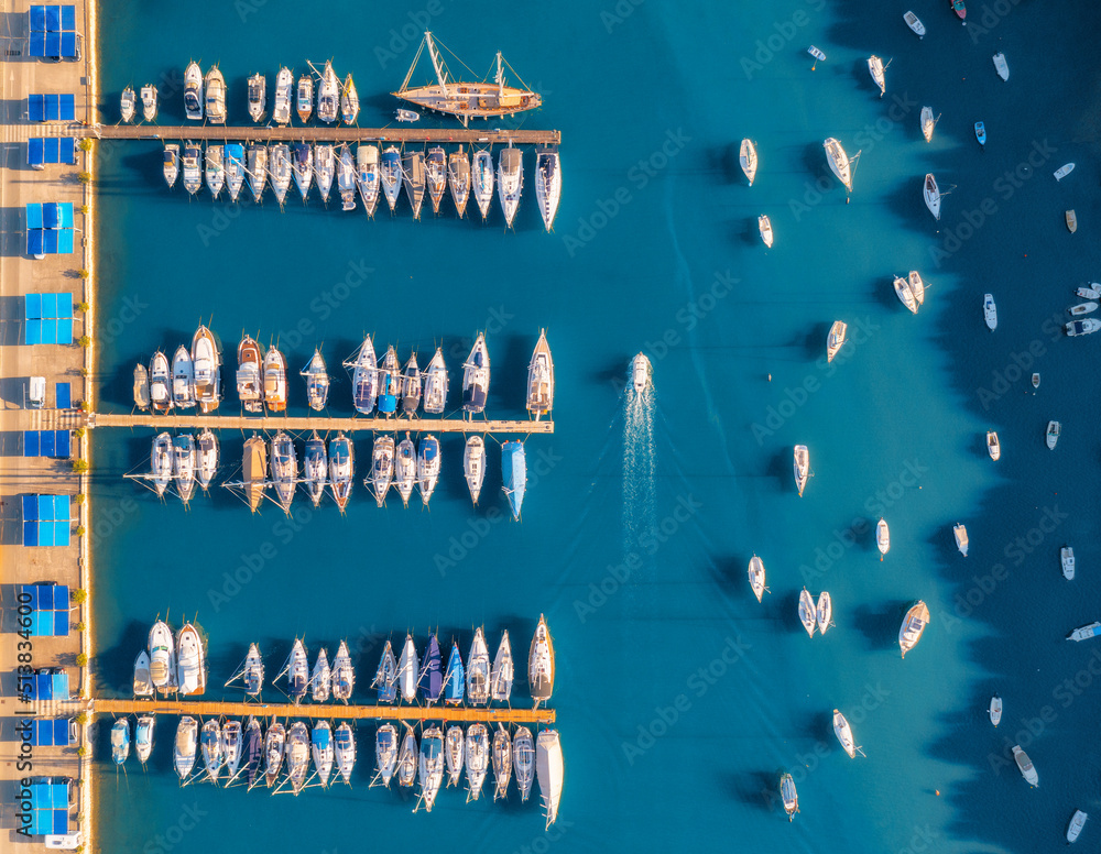 Aerial view of boats and luxure yachts in dock at sunset in summer in Pula, Croatia. Colorful landsc