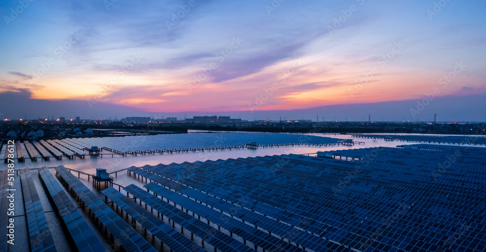 Aerial view of solar power station at beautiful sunset. solar photovoltaic power station on water. g