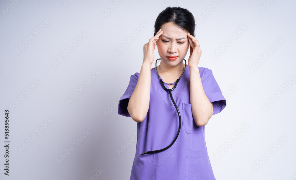 Portrait of young Asian nurse on white background