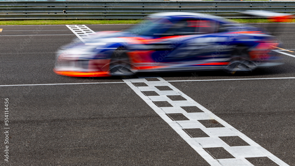 Race car blurred motion crossing the finish line on international circuit speed track, Motion blur R