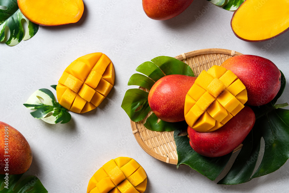 Mango background design concept. Top view Diced fresh mango fruit on gray table.