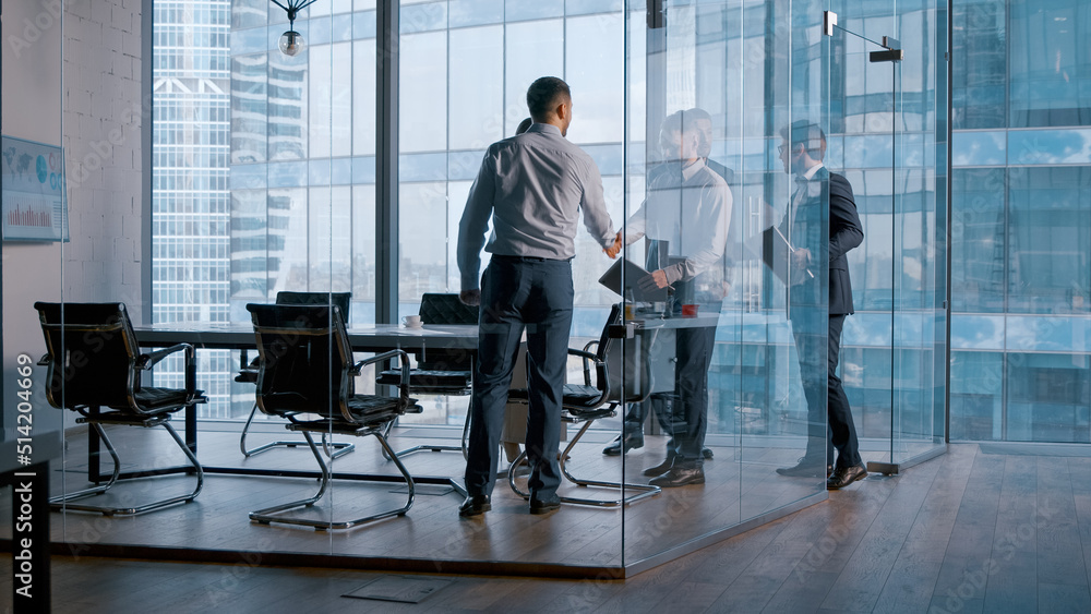 Office concept: meeting of business partners in a conference room to discuss contracts