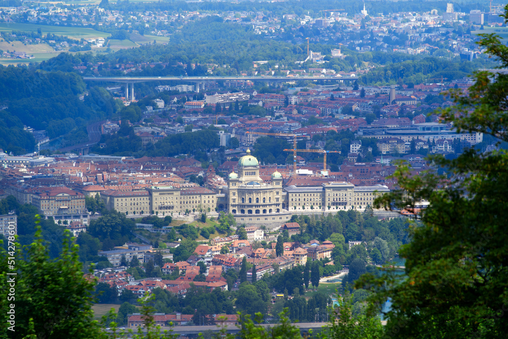 Aerial view over City of Bern and Canton Bern seen from local mountain Gurten on a blue cloudy summe