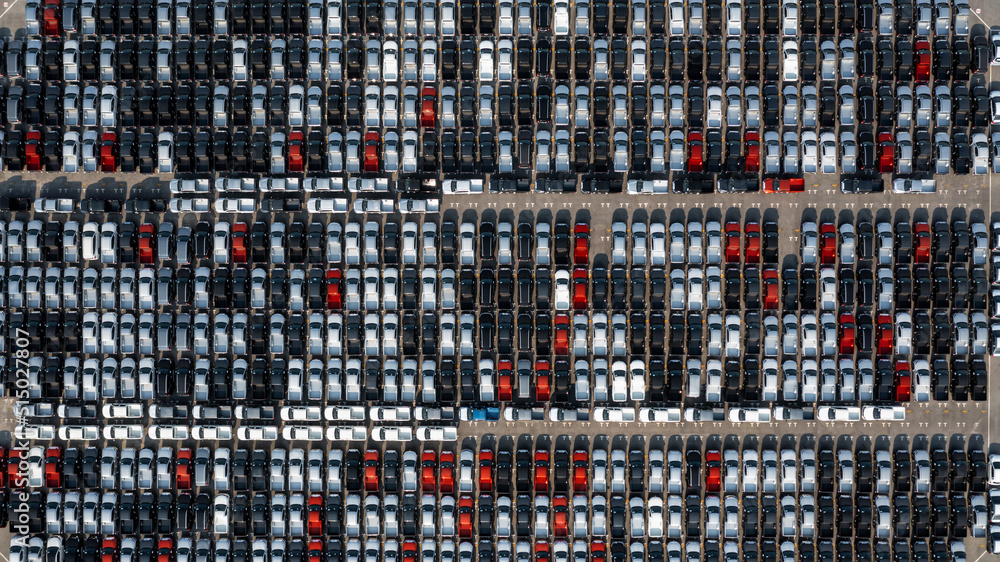 Aerial top view rows of new cars parked in distribution center on car factory, Automobile and automo