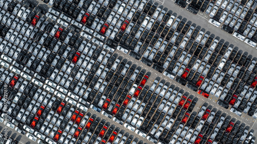 Aerial top view rows of new cars parked in distribution center on car factory, Automobile and automo