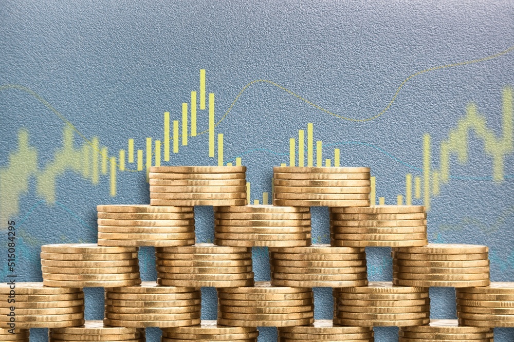 Stack of coins next to a curve symbolizing rising costs due to inflation