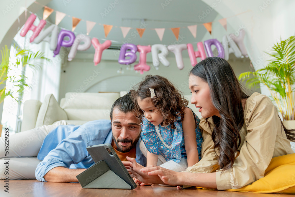 Happiness Family sitting in casual living room with wireless Internet connection at home, Girl daugh