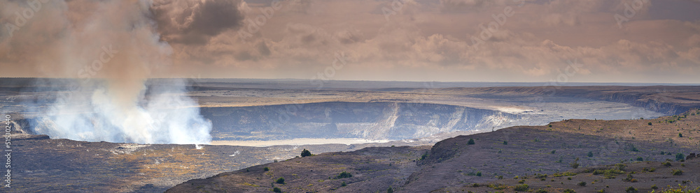 Mouna Kea most active volcano on a cloudy day. Extreme panoramic landscape of Hawaiian mountain with