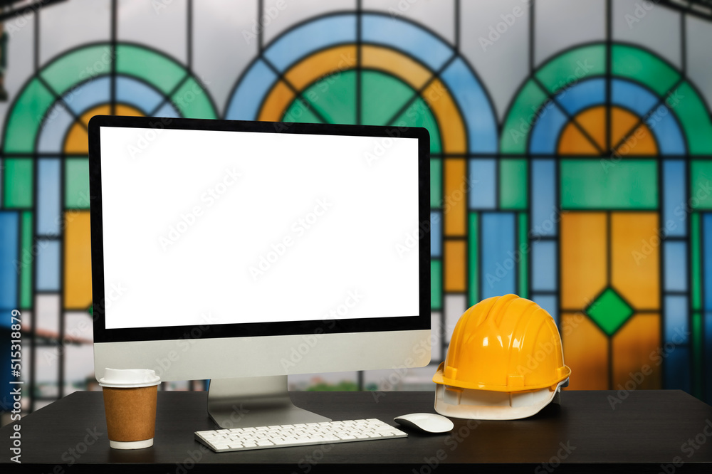 Workspace computer putting  and office construction on table in modern office blurred background.Arc