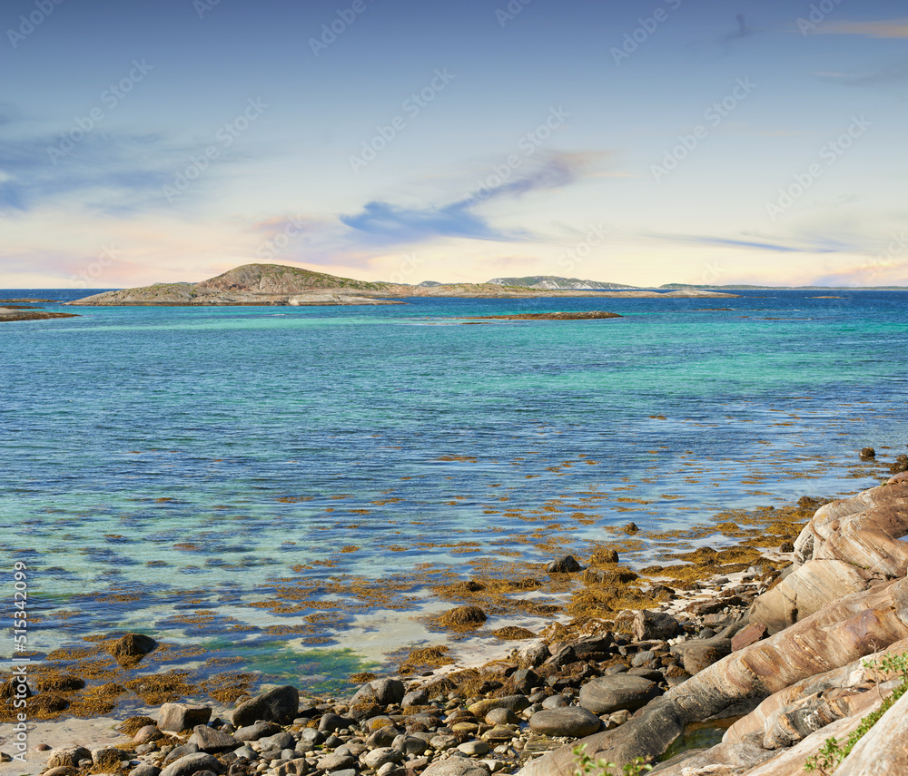 Landscape of empty rocky sea or river shore on summer day outside. Calm serene horizon, vibrant peac