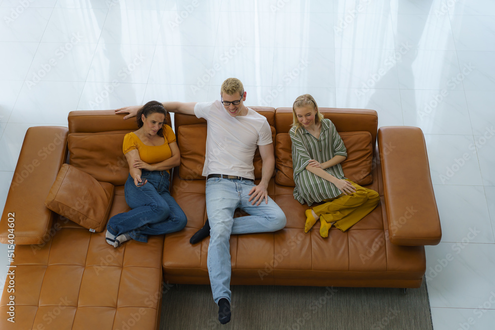 Top view of Caucasian happy family sitting and watching television in living room at home and spent 