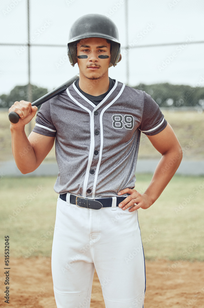 Portrait of baseball player looking focused with paint on his face. Serious and fit, active athlete 