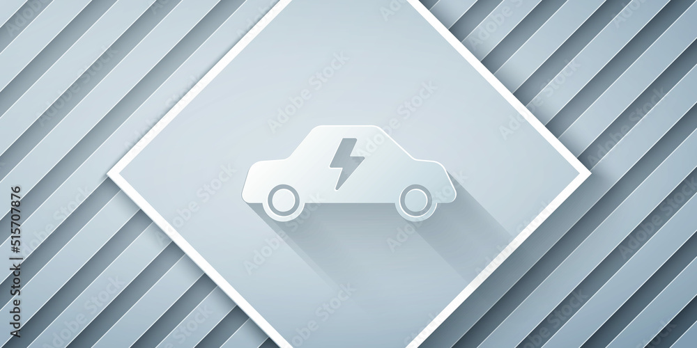 Paper cut Electric car and electrical cable plug charging icon isolated on grey background. Renewabl