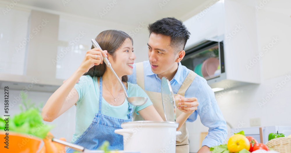 young couple are cooking together