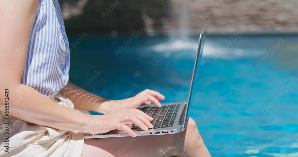 girl use phone on pool