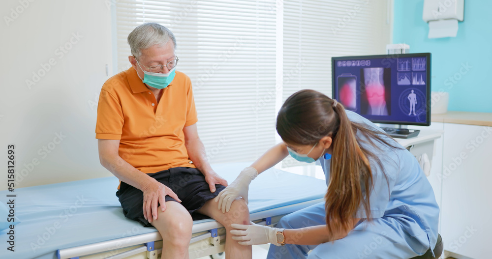 doctor examining patient knee