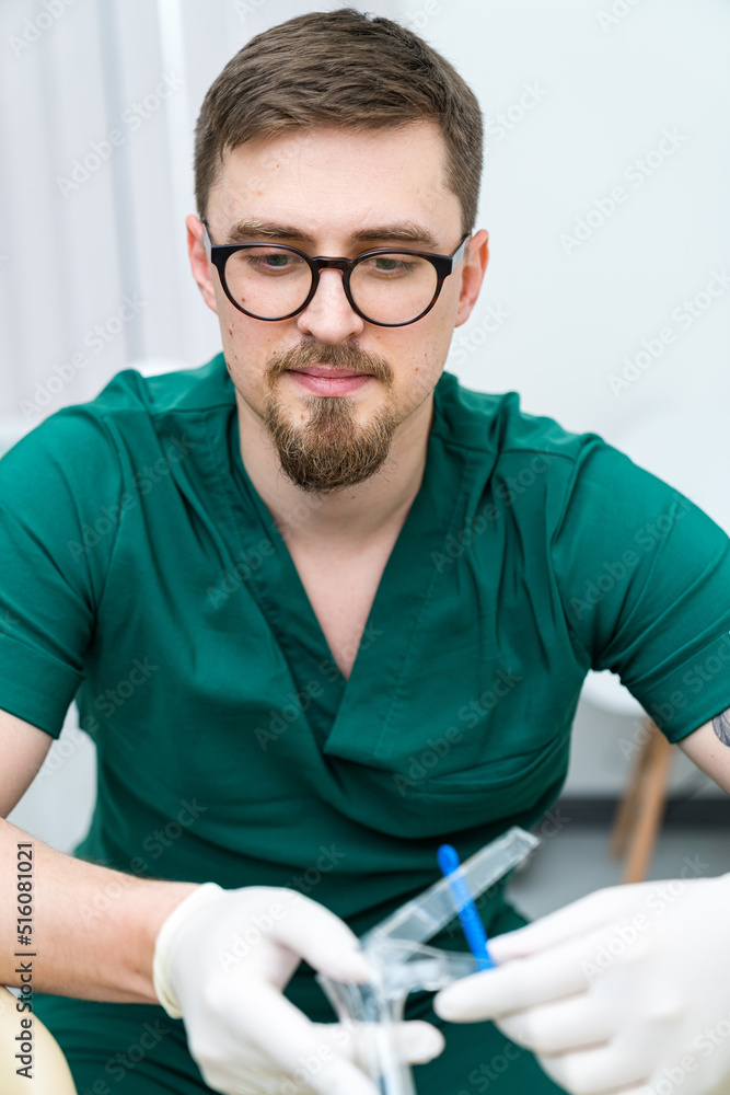 Professional physician working in hospital. Confident doctor in uniform.