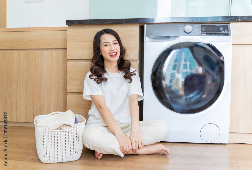 Image of Young Asian woman washing clothes