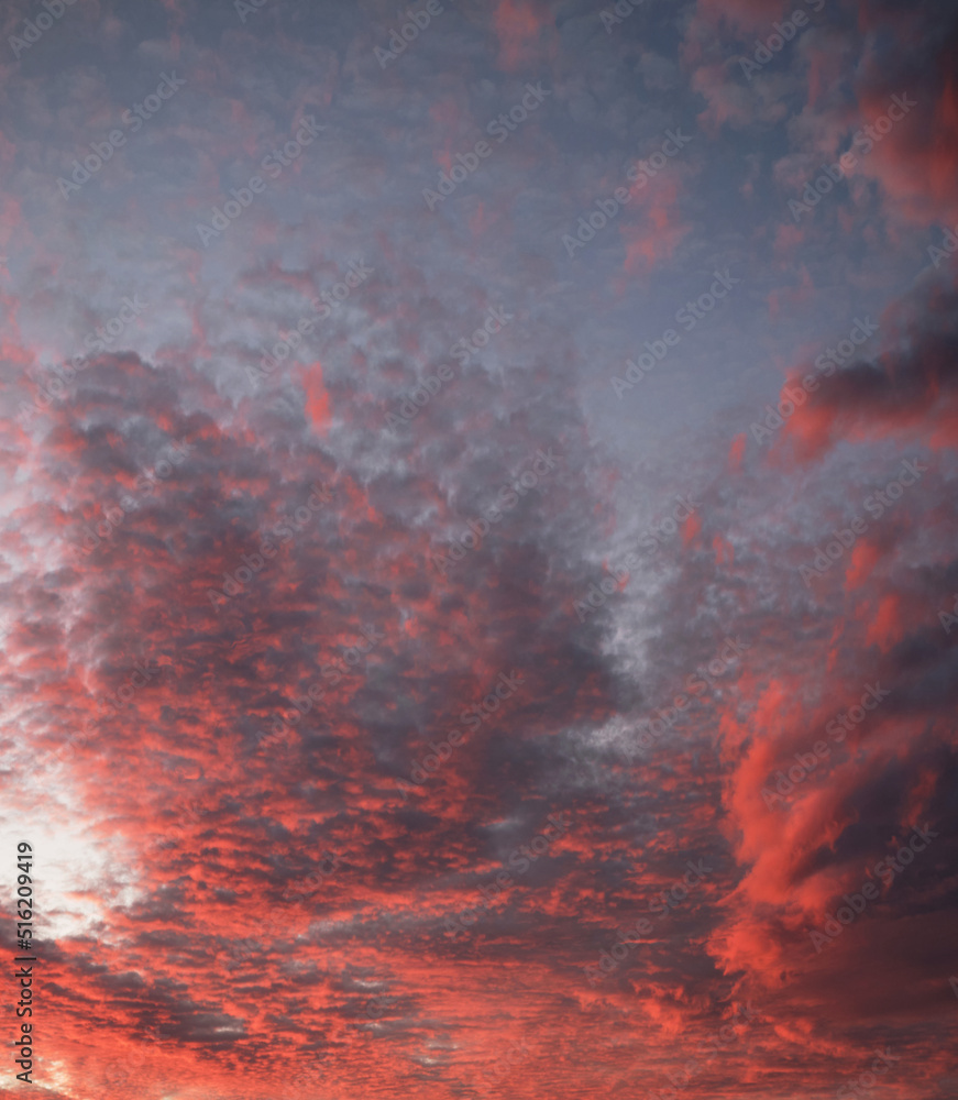 Amazing sunset sky with red clouds. Abstract nature background