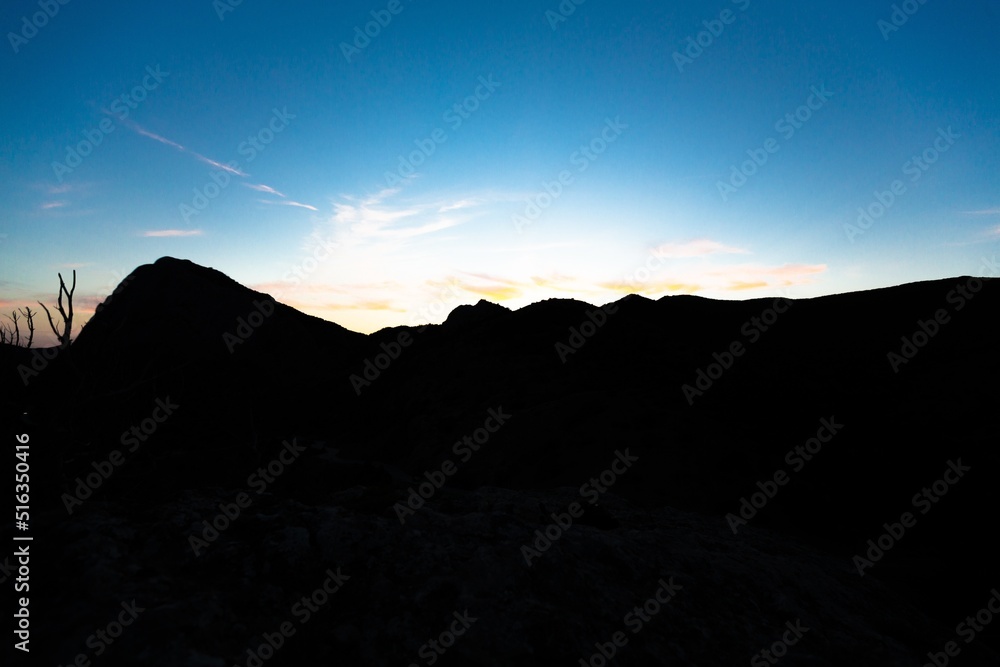 Beautiful nature landscape. Dark silhouette mount with sky.