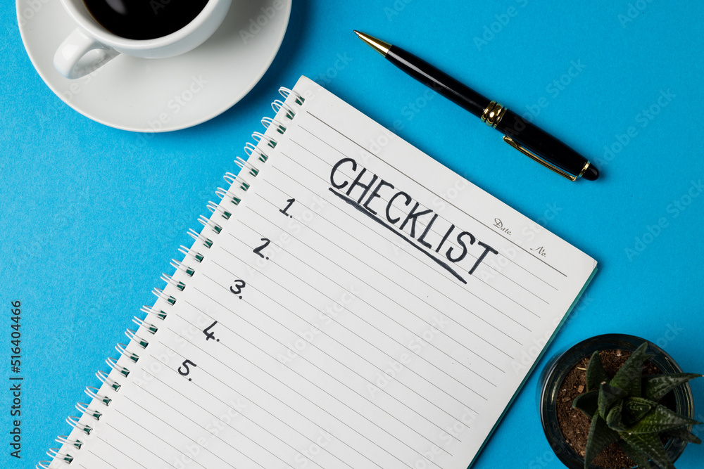 Image of notebook with checklist and copy space, coffee and pen on blue surface