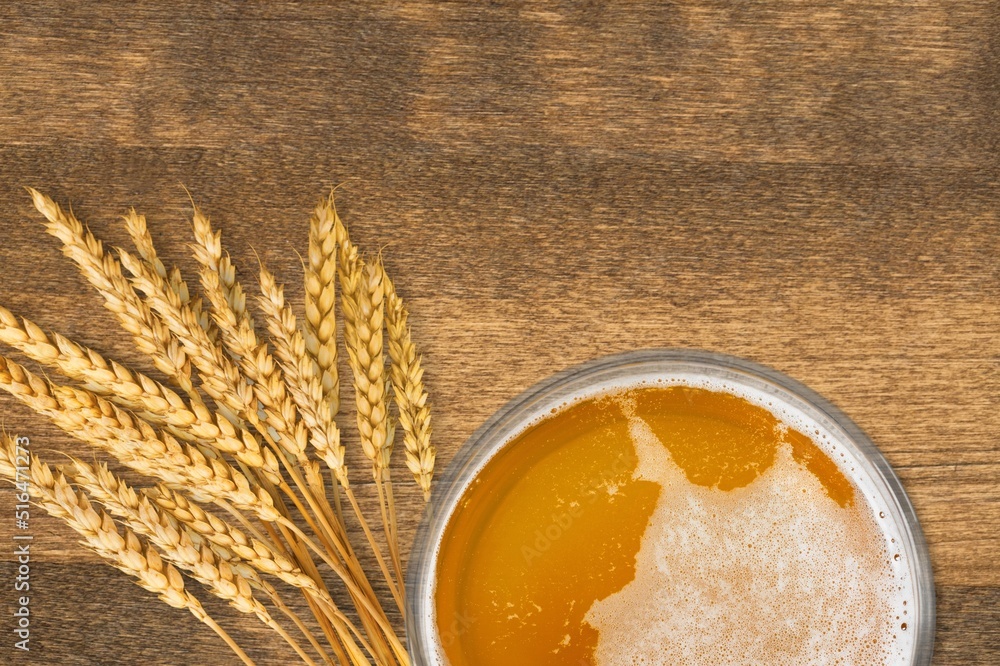 beer ingredients, barley near beer glass on the desk