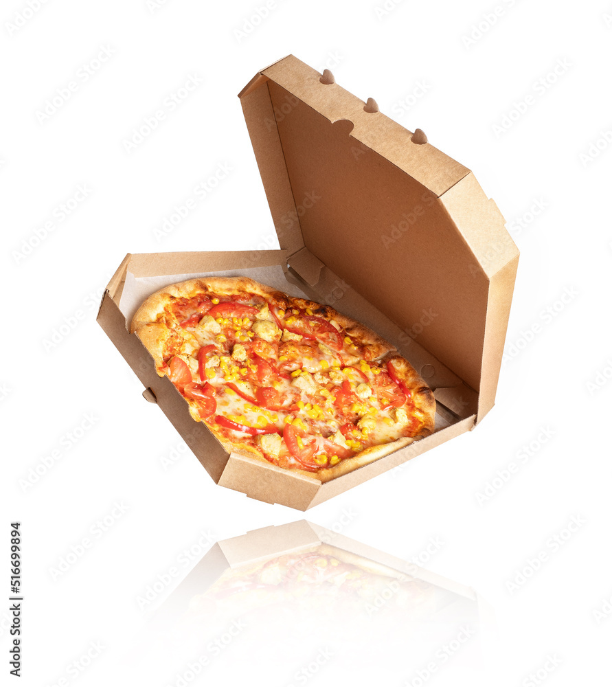 Freshly baked pizza with chicken meat and ingredients in a cardboard box on a white background