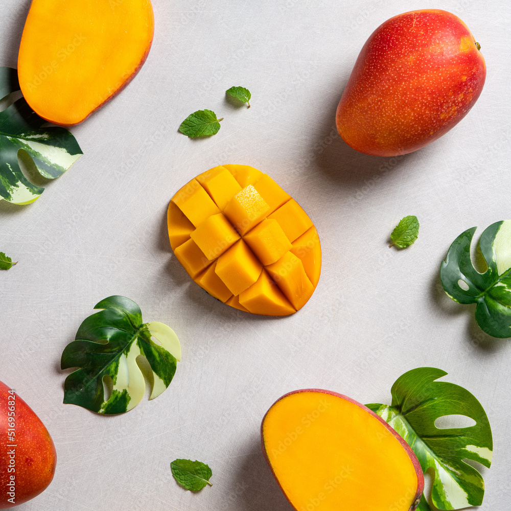 Mango background design concept. Top view Diced fresh mango fruit on gray table.