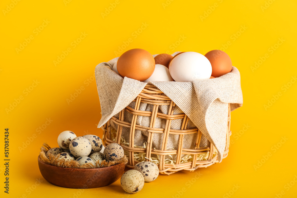 Bowl and basket with different eggs on color background