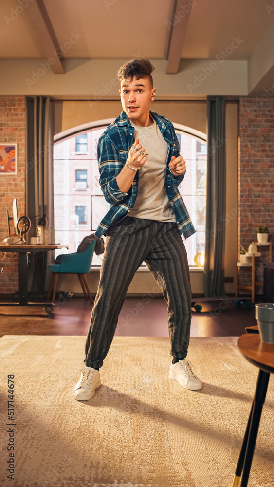 Vertical Screen: Handsome Young Man Recording a Dancing Routine on Smartphone Video for Social Media