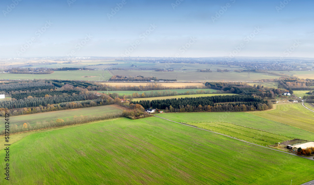 Landscape aerial view of a farm in the countryside in summer. Agricultural field for farming, cultiv