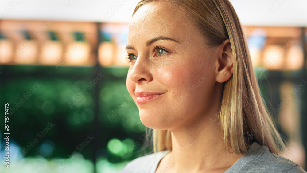 Authentic Portrait of Beautiful Young Female in Kitchen Room at Home Looking Thoughtfully at Her Bac