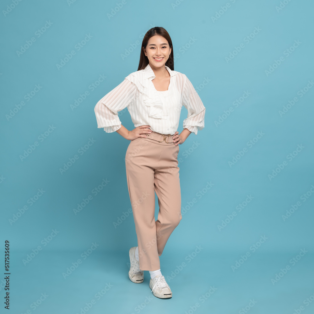 Young beautiful asian woman with smart casual cloth smiling isolated on blue background