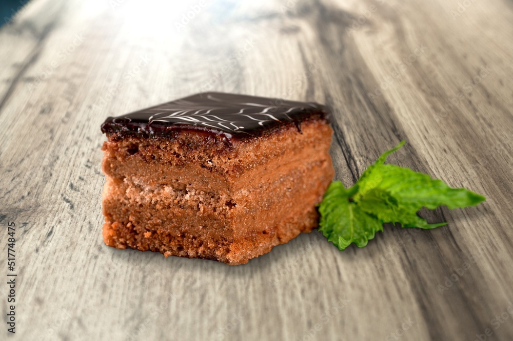 Tasty sweet cake decorated with fresh green mint leaf.Traditional dessert.