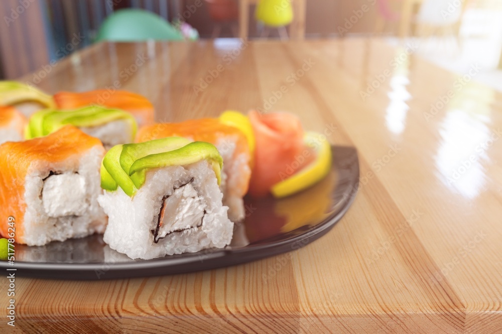 Sushi rolls set. Traditional japanese dish sushi and rolls with fresh salmon, tuna, prawns on rice. 