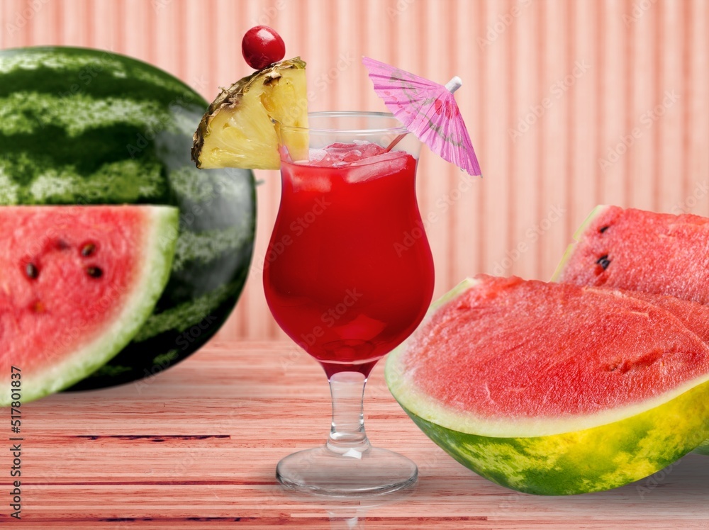 Tasty ripe fresh watermelon juice or smoothie in glasses with watermelon pieces. Refreshing summer d