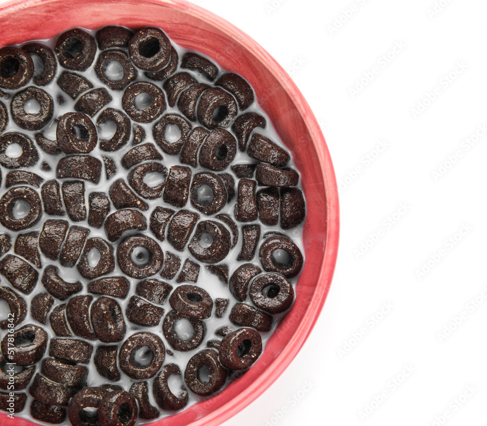 Bowl of tasty cereal rings with milk on white background, closeup