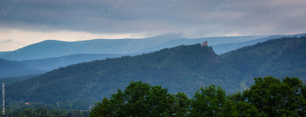 Misty sunset over the Chojnik Castle in Giant Mountains. Poland