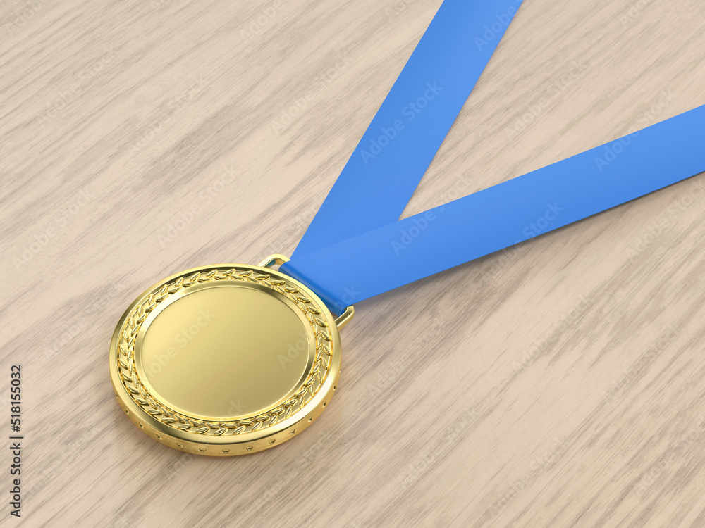 Gold medal on the wooden desk