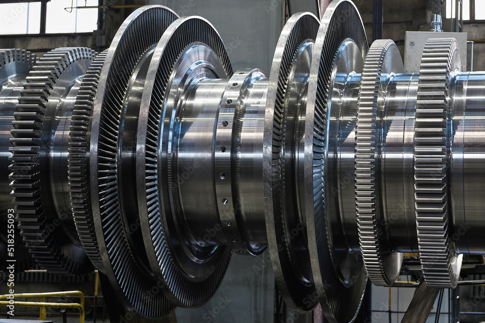 New rotor of powerful steam turbine in plant workshop