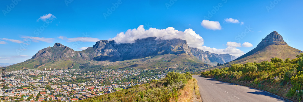 Table Mountain is a hiking destination for tourists and locals surrounded by nature, trees and house