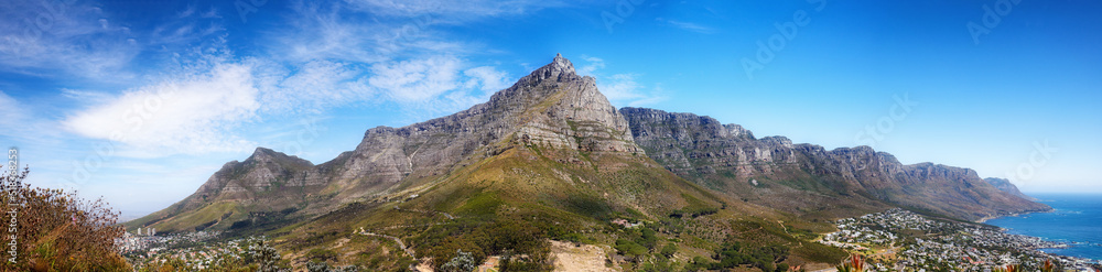 Landscape panorama of mountains, sea and coastal city with blue sky in famous travel and tourism des