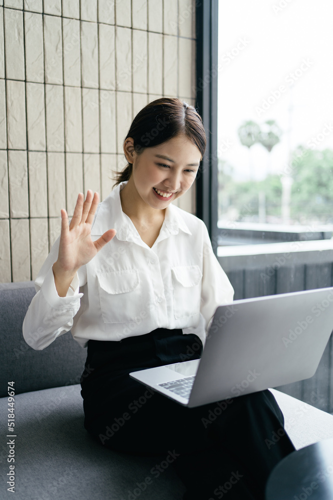 Asian woman working with laptop in her office. business financial concept.