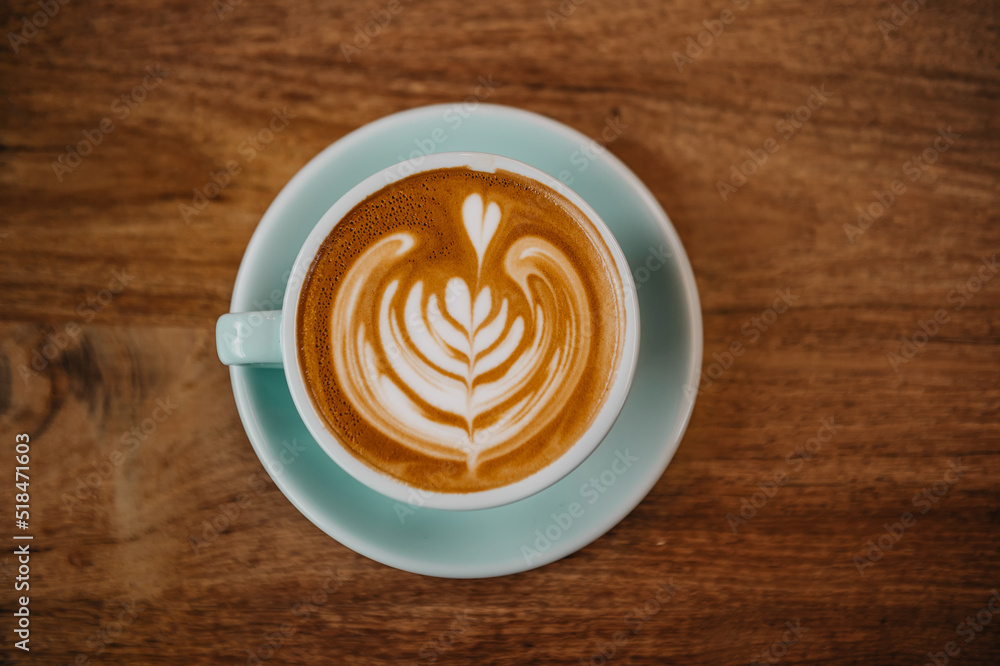 great latte art coffee design  and wooden table