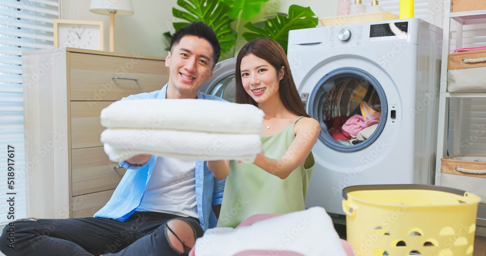 asian couple do laundry