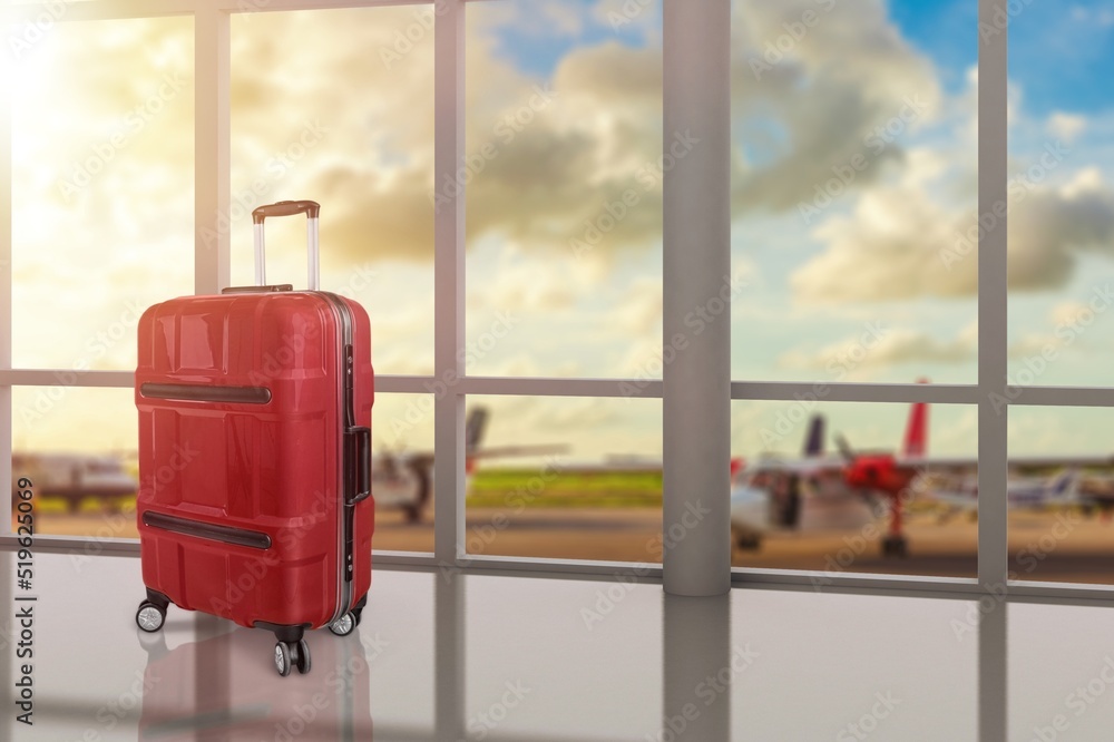 Travel concept with luggage in the airport terminal waiting area, summer vacation concept, traveling