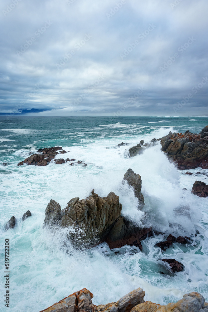 The beautiful coastline at De Kelders with a view across Walker Bay towards Hermanus, Overberg, West