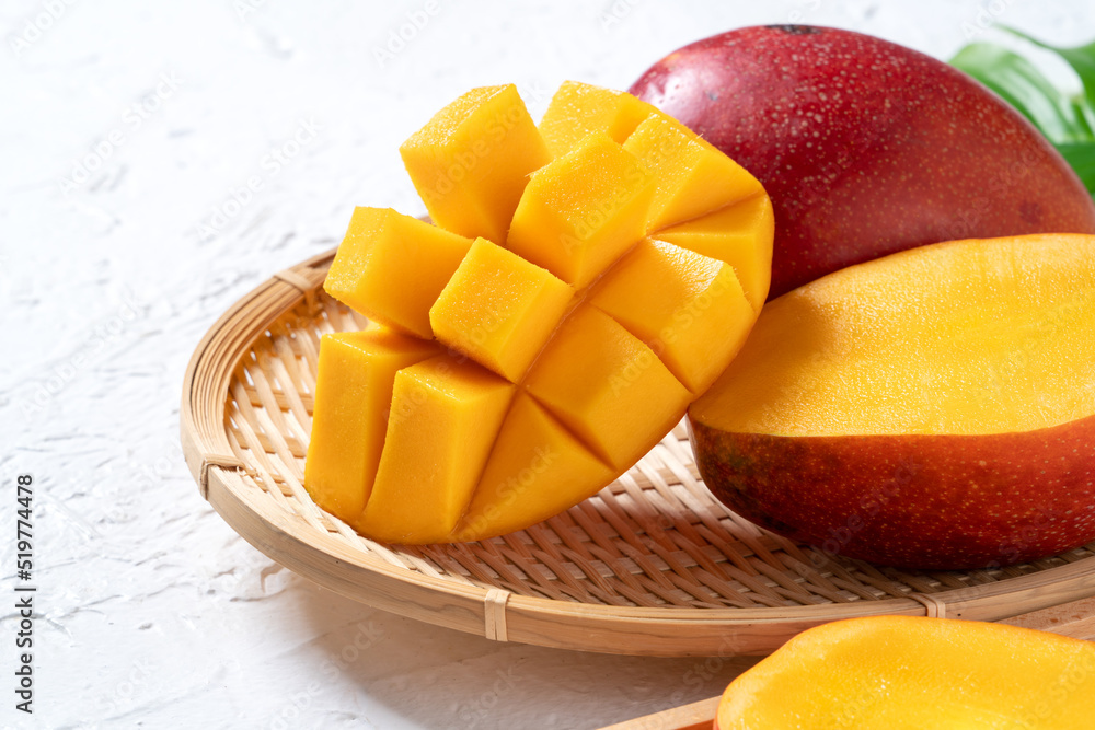 Mango background design concept. Top view Diced fresh mango fruit on white table.